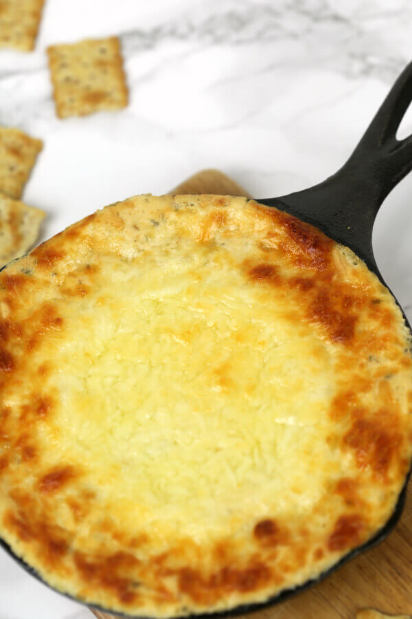 White Pizza Dip in a skillet with crackers