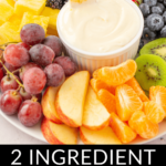A vibrant platter of assorted fruits with a Marshmallow Fluff Fruit Dip, labeled as a two-ingredient recipe.
