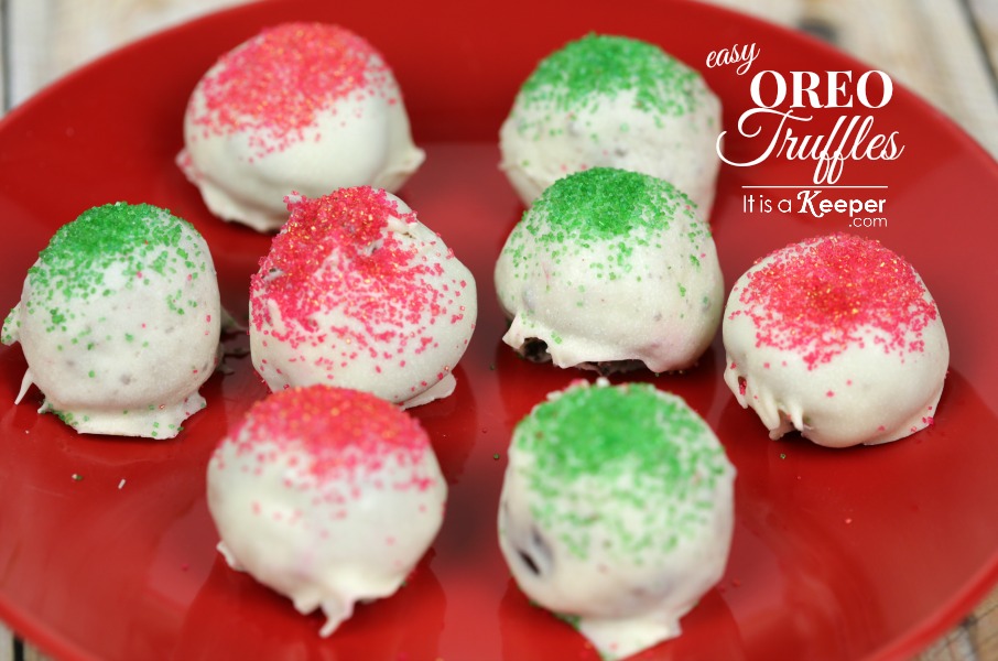 Easy Oreo Balls with red and green sprinkles, on a red plate. 