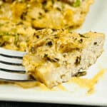 A piece of pork on a fork, seared to perfection.