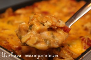 King Ranch Chicken Casserole in a glass casserole dish with a metal spoon