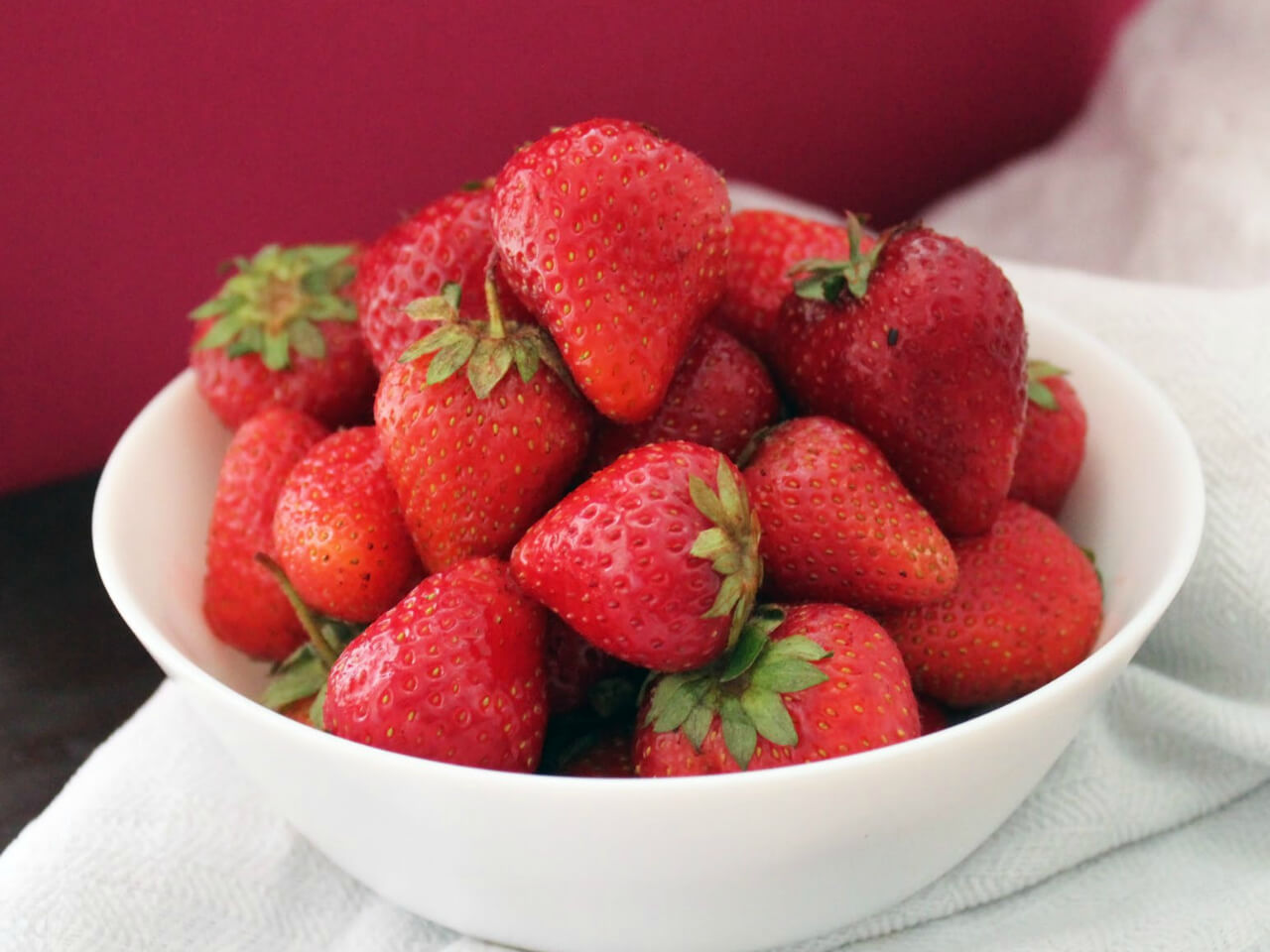 strawberry in white bowl. 