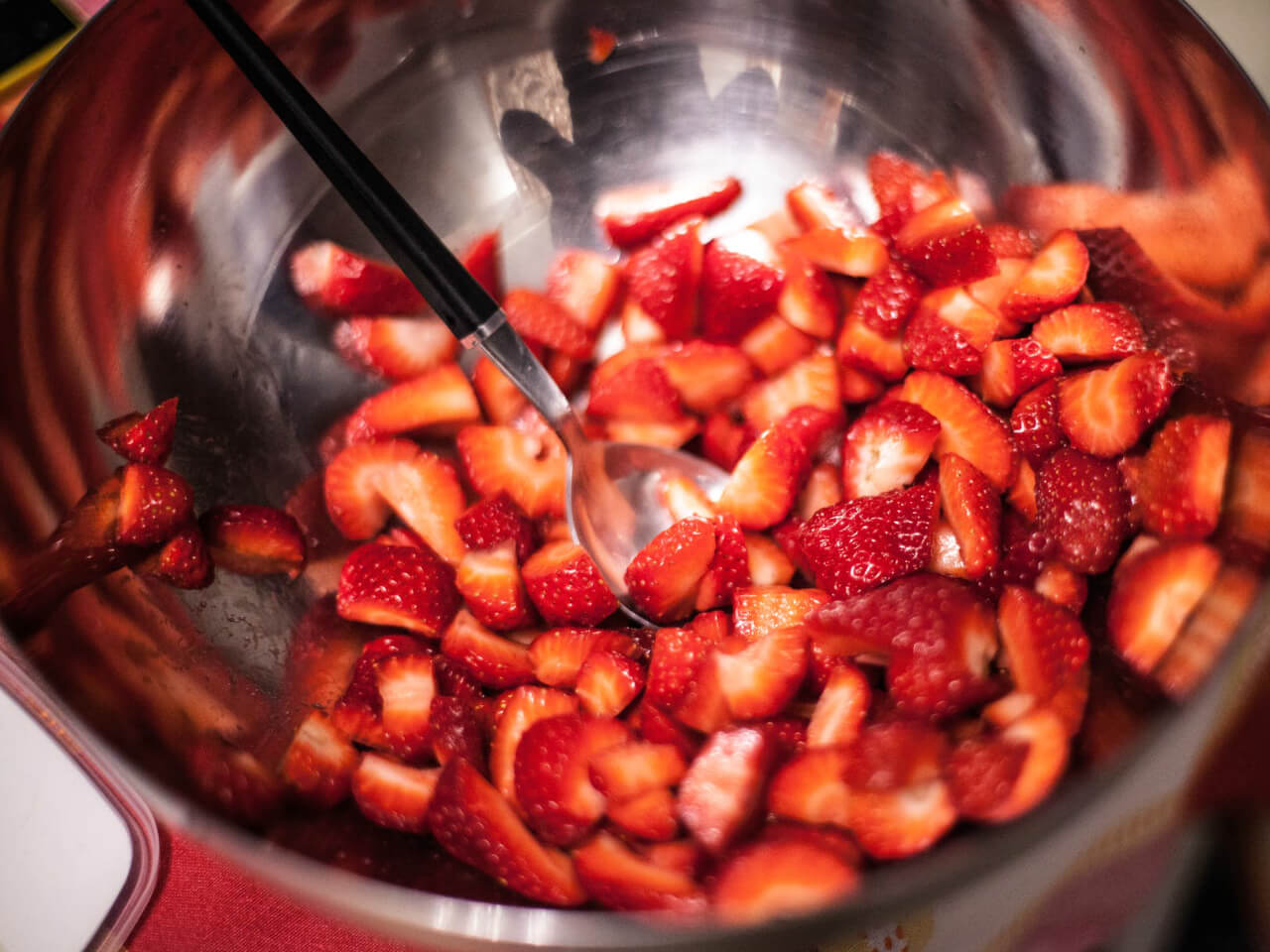Strawberries in a metal bowl. 