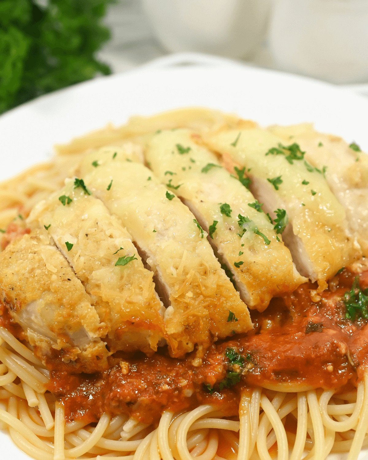 Slow cooker chicken parmesan with spaghetti.