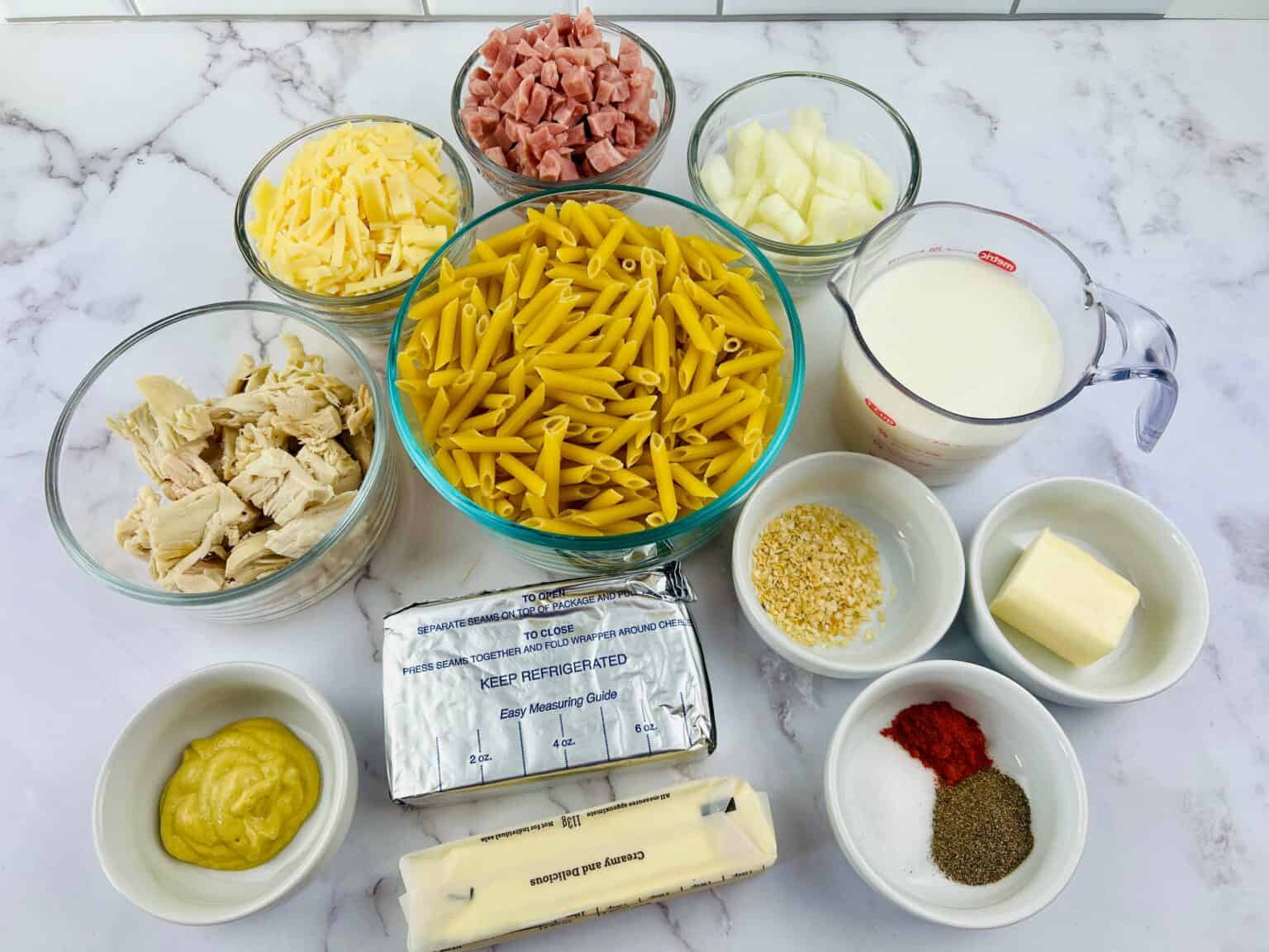 Ingredients for making a chicken cordon bleu casserole dish displayed on a kitchen counter.