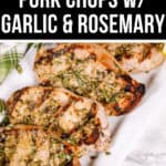 Grilled Boneless Pork Chops with garlic and rosemary, beautifully arranged on a white plate with fresh herbs and a lemon slice garnish.