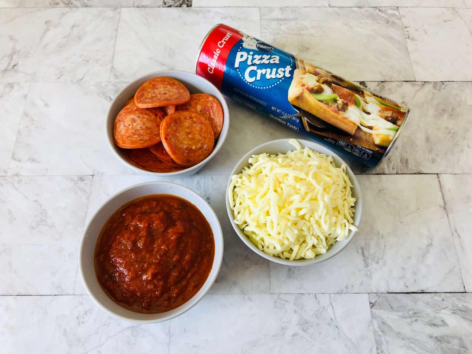 Meat, cheese, sauce and a tube of dough.