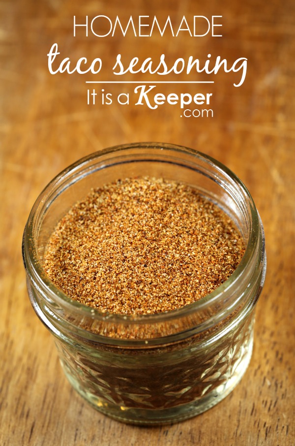 Homemade Taco Seasoning in a glass jar on a wooden table
