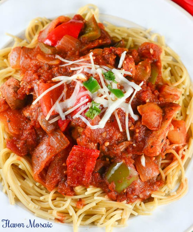 This Slow Cooker Chicken Cacciatore is a hearty, slow cooked Italian chicken main dish with tomatoes, onions, garlic, and red and green bell peppers, served over pasta. This is one of the best slow cooker chicken recipes. 