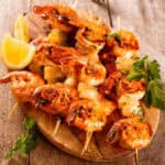 Beautiful Shrimp Skewers on a plate with lemon.