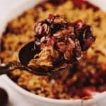 A casserole dish with apple blueberry crisp.