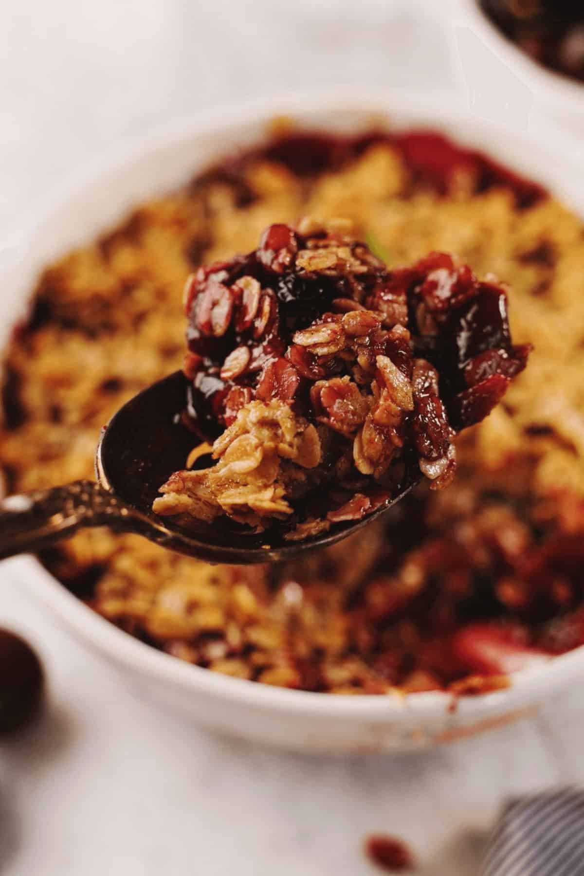 A casserole dish with apple blueberry crisp.