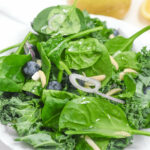A kale and spinach salad with citrus vinaigrette.