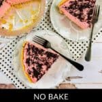 Two plates with slices of pink raspberry cream pie and forks sit next to a partially eaten pie in a foil tin on a white wooden surface.