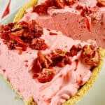 A close-up of a pink-pie on a plate.