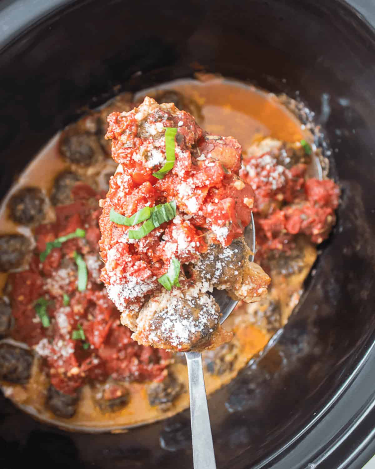 A spoonful in the liner of the slow cooker.