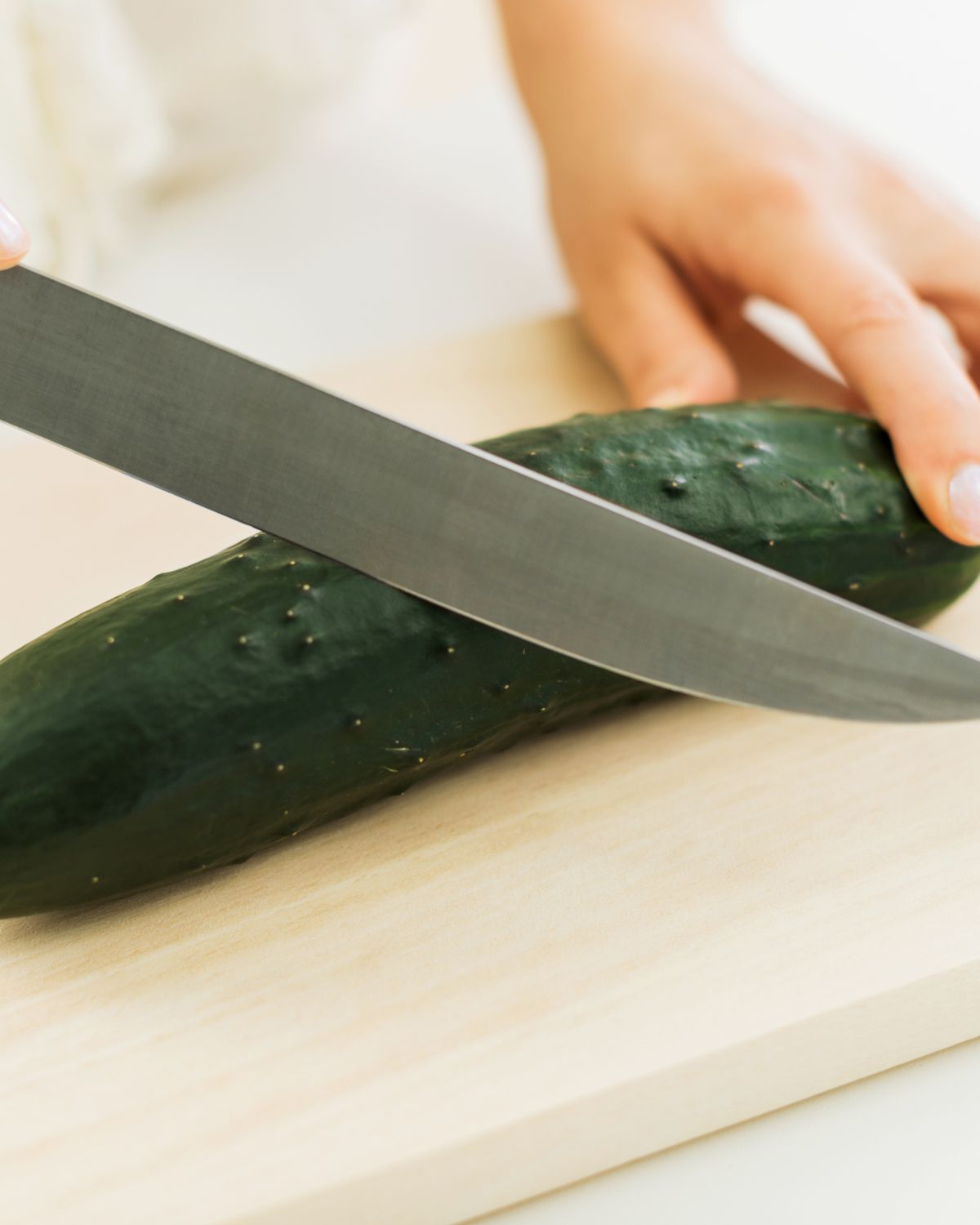 Slicing a cucumber.