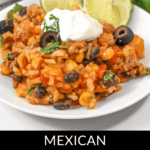 A plate of flavorful Mexican Beef and Rice Skillet with black olives, corn, and sour cream, garnished with cilantro and two lime wedges. The text reads, "Mexican Beef and Rice Skillet.