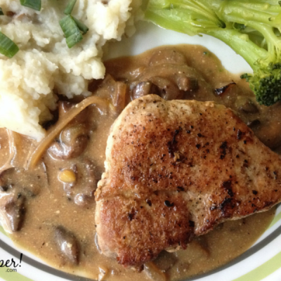 Pan seared pork chops quickly finish in the oven and are paired with an easy mushroom gravy.