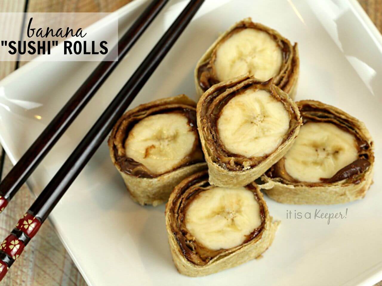 Banana Sushi Rolls on a white plate accompanied by black chop sticks for eating