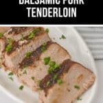 Sliced balsamic pork tenderloin, slow-cooked to perfection in a crock pot, is elegantly garnished with parsley on a white plate.