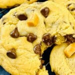 A Caramel Chocolate Chip Cookies with a bite taken out.