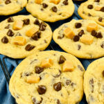 A Caramel Chocolate Chip Cookies on a cooling rack.