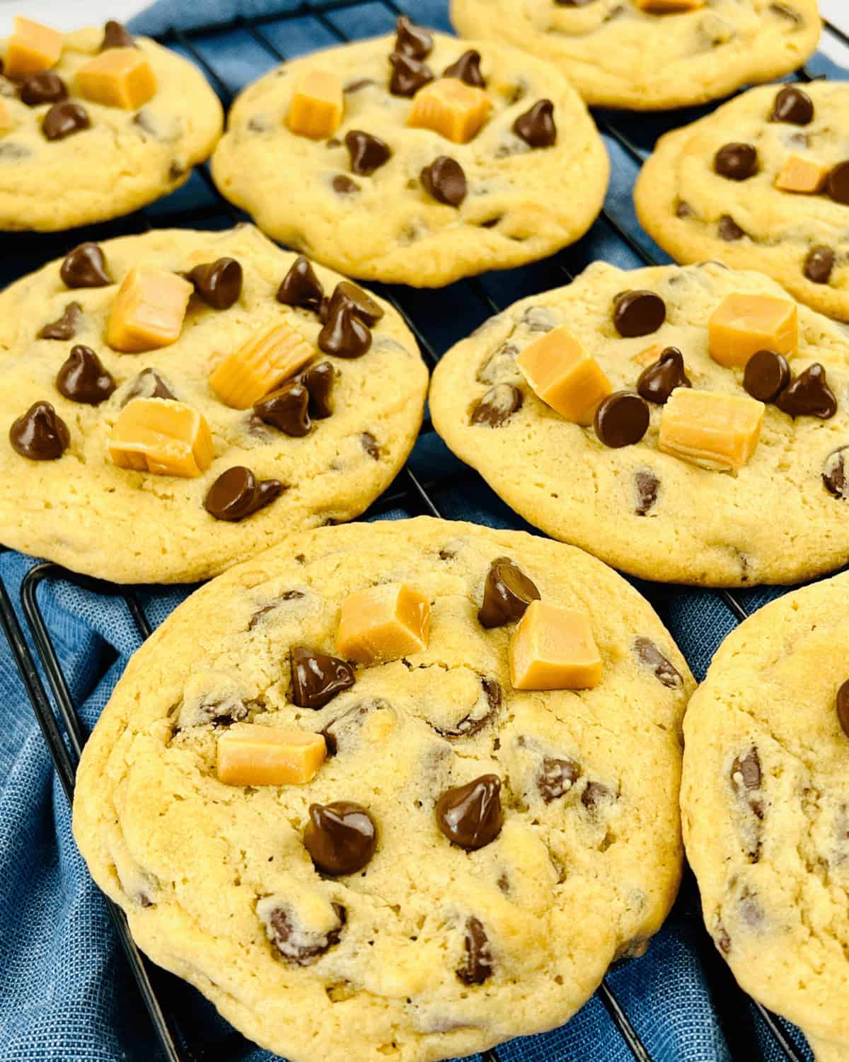 A Caramel Chocolate Chip Cookies on a cooling rack.