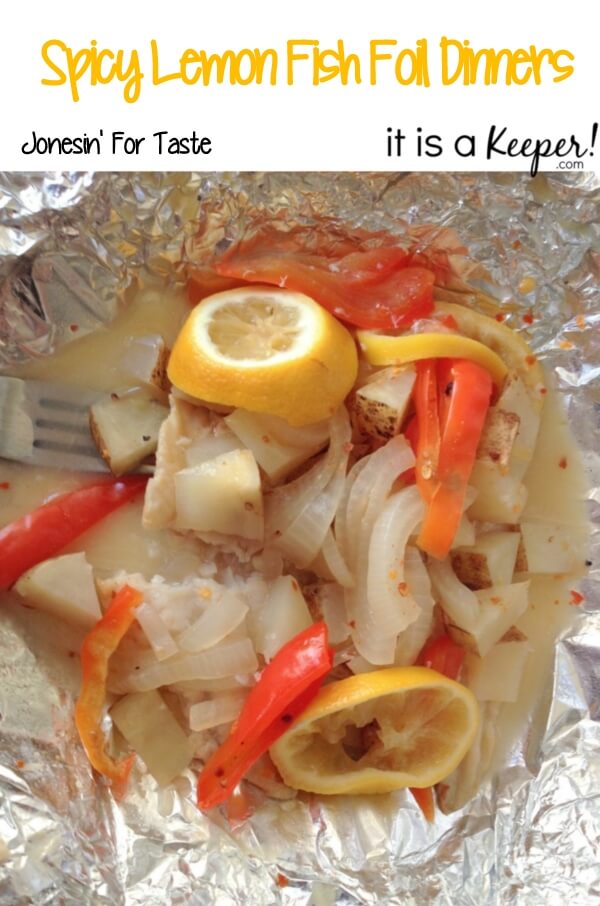  Spicy Lemon Foil Fish in tin foil, with a metal fork. 
