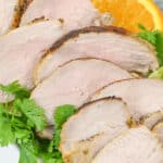 A dish of the Cuban mojo pork with greens on the side.