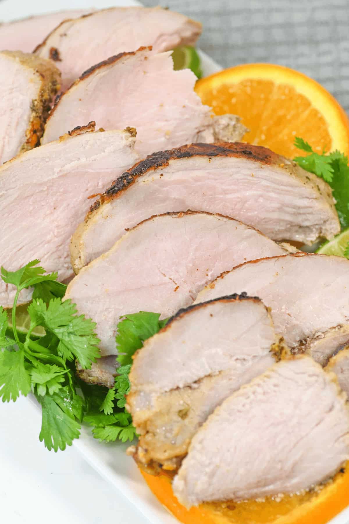 A dish of the Cuban mojo pork with greens on the side.