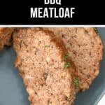 Two slices of rich, savory BBQ meatloaf rest on a gray plate, their glaze glistening under the light, garnished elegantly with fresh herbs.