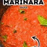 A close-up of homemade Hearty Marinara Sauce in a pan, topped with fresh basil leaves. Text on image reads "Hearty Marinara Sauce Homemade.