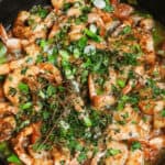 A cast iron skillet of Caribbean jerked shrimp.