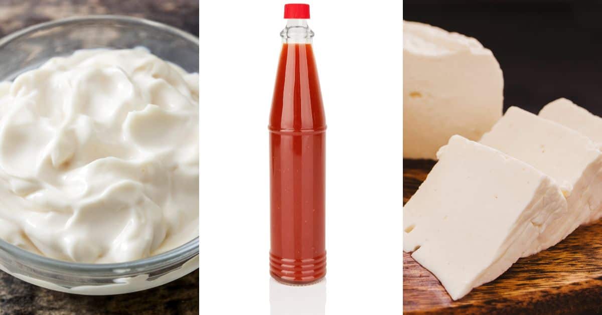 A bottle of sour cream, a bowl of cheese, and a bottle of hot sauce.