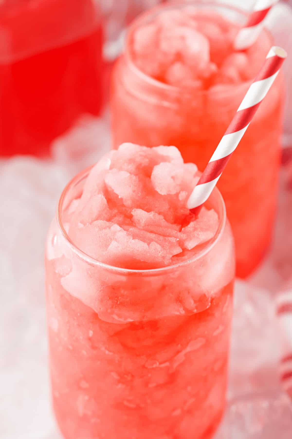 A colorful glass of kool-aid slushie.
