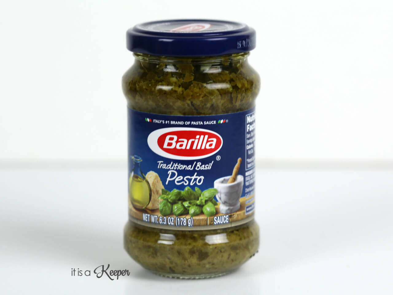 Barilla pesto sauce with a white ba kground.