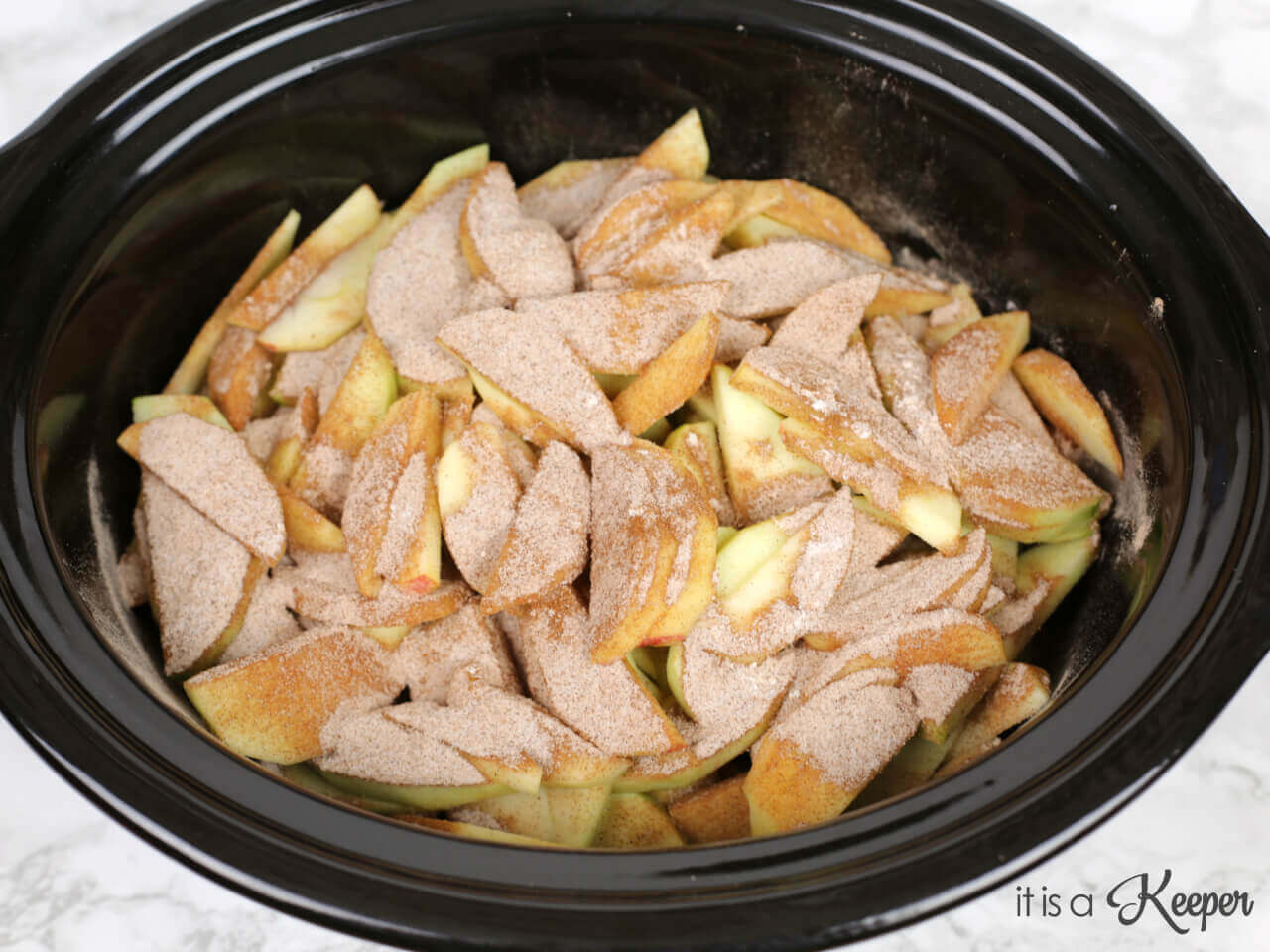 apples with sugar and cinnamon in a slow cooker