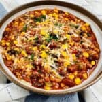 The chili on a checkered mat.