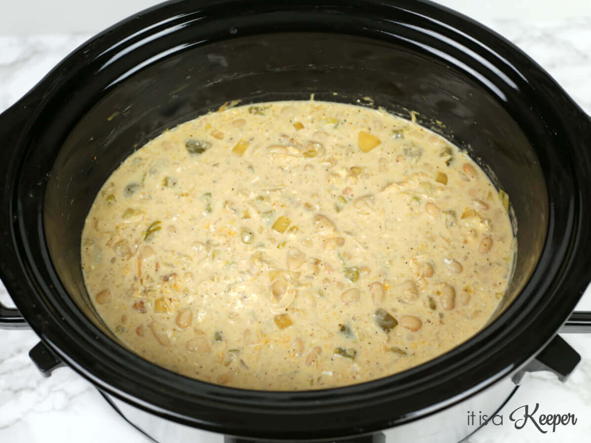 Slow Cooker White Chicken Chili mixture in a slow cooker.