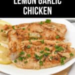 A white plate with tender Lemon Garlic Chicken pieces garnished with chopped parsley and lemon slices on the side. Text above reads "Easy Skillet Lemon Garlic Chicken.