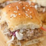 A closeup of shredded pork sliders.
