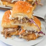 A stack of shredded pork sliders.