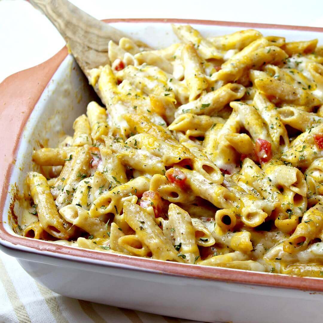 Three Cheese Penne Pasta Casserole in a white and light brown dish.