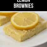 A slice of zesty lemon brownie topped with a fresh lemon slice rests elegantly on a pristine white plate.