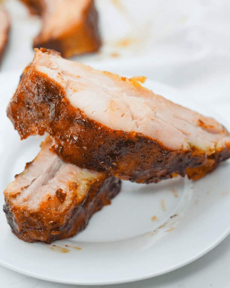 Slow Cooker beef ribs on a white plate.