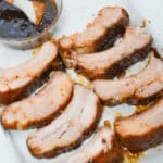 Slow Cooker BBQ Pork Ribs on a Baking Sheet with Sauce.