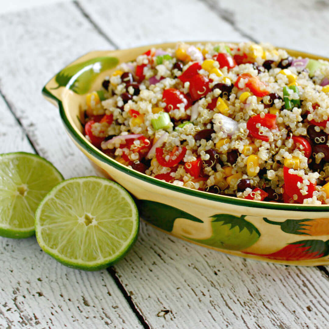 Southwest Quinoa Salad in a bowl with limes.