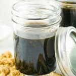 Glass jars containing homemade honey teriyaki sauce.