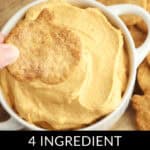 A hand dips a pumpkin-shaped cracker into a bowl of tantalizingly creamy Pumpkin Dip. Text at the bottom reads: "4 Ingredient Pumpkin Dip.